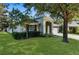 Charming single-story home with lush lawn, mature trees, and attached two car garage at 1280 Hill Flower Dr, Brooksville, FL 34604
