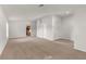 Spacious living room with neutral carpet and paint provides a blank canvas for personalization at 1280 Hill Flower Dr, Brooksville, FL 34604