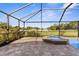 Screened-in pool and spa with a brick paver patio, perfect for outdoor entertaining at 1280 Hill Flower Dr, Brooksville, FL 34604