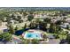 Aerial view of the community pool, clubhouse, and surrounding residential area at 12904 Prestwick Dr, Riverview, FL 33579
