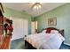 Comfortable bedroom with a full-sized bed, closet, and green walls at 12904 Prestwick Dr, Riverview, FL 33579