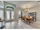 Bright dining area with stylish lighting, wood table, and beautiful window at 12904 Prestwick Dr, Riverview, FL 33579