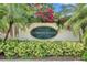 Community entrance sign for Clubhouse Estates surrounded by lush greenery and flowers at 12904 Prestwick Dr, Riverview, FL 33579