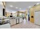 Well-lit kitchen with stainless steel appliances, and an open view of the living area at 12904 Prestwick Dr, Riverview, FL 33579