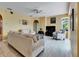 Comfortable living room with a ceiling fan, modern decor, and lots of natural light at 12904 Prestwick Dr, Riverview, FL 33579