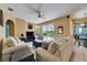Inviting living room featuring comfortable seating and a view of the pool area at 12904 Prestwick Dr, Riverview, FL 33579