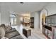 Open-concept living space with wood-look floors, dining area, and comfortable seating at 12904 Prestwick Dr, Riverview, FL 33579