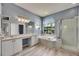 Spacious main bathroom with dual sinks, soaking tub, and separate shower at 12904 Prestwick Dr, Riverview, FL 33579