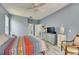 Bright main bedroom with ensuite bathroom, ceiling fan, and stylish furnishings at 12904 Prestwick Dr, Riverview, FL 33579