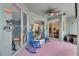 Covered patio with ceiling fan and blue rocking chairs, great for relaxing outdoors at 12904 Prestwick Dr, Riverview, FL 33579