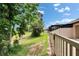 Fenced yard with mature trees and a well-maintained lawn, perfect for outdoor gatherings at 14047 Weddington Ter, Hudson, FL 34669