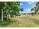 The beautiful lake view from the backyard offers a serene and picturesque setting at 14047 Weddington Ter, Hudson, FL 34669