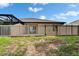 Fenced yard with a spacious backyard, providing security and space for outdoor activities at 14047 Weddington Ter, Hudson, FL 34669