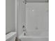 Bathroom features tiled shower-tub combination and updated fixtures at 14047 Weddington Ter, Hudson, FL 34669