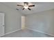 Bright bedroom featuring a ceiling fan, neutral walls and carpet, offering a serene retreat at 14047 Weddington Ter, Hudson, FL 34669