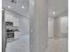 Modern kitchen featuring stainless steel appliances, white cabinets, and tile flooring at 14047 Weddington Ter, Hudson, FL 34669