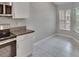 Kitchen with granite countertops, stainless steel appliances, and an adjacent breakfast nook at 14047 Weddington Ter, Hudson, FL 34669