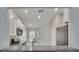 Modern kitchen featuring white cabinets, stainless appliances, granite counters, and ample natural light at 14047 Weddington Ter, Hudson, FL 34669