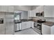 Kitchen with stainless steel appliances, granite countertops, and a view of the patio at 14047 Weddington Ter, Hudson, FL 34669