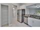 Kitchen featuring stainless steel appliances, granite countertops, and an adjacent pantry at 14047 Weddington Ter, Hudson, FL 34669
