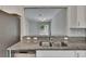 Open kitchen area with granite countertops, stainless steel appliances, and breakfast bar at 14047 Weddington Ter, Hudson, FL 34669