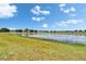 The sprawling lake and manicured lawn create a perfect backdrop at 14047 Weddington Ter, Hudson, FL 34669