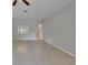 Open-concept living room with tile floors, neutral walls, and a passthrough to the kitchen at 14047 Weddington Ter, Hudson, FL 34669
