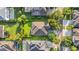 An aerial view of a beautiful home surrounded by mature landscaping and well-manicured lawns at 15405 Woodstar Landing Ct, Lithia, FL 33547