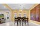 Dining area with modern lighting and artwork at 15405 Woodstar Landing Ct, Lithia, FL 33547