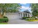 Well-maintained home with a spacious driveway and attached two-car garage at 15405 Woodstar Landing Ct, Lithia, FL 33547