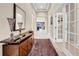 Spacious foyer with a decorative console table and access to living areas at 15405 Woodstar Landing Ct, Lithia, FL 33547