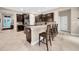 Well-lit kitchen boasts a large island with seating and lots of counter space at 15405 Woodstar Landing Ct, Lithia, FL 33547