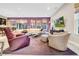 Bright and open living room with a plush sectional sofa and entertainment area at 15405 Woodstar Landing Ct, Lithia, FL 33547