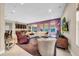 Large living area with a comfortable seating arrangement and natural light at 15405 Woodstar Landing Ct, Lithia, FL 33547