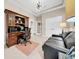 Office space featuring a desk, workspace, and a comfortable seating area with natural light at 15405 Woodstar Landing Ct, Lithia, FL 33547
