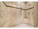 A tile shower with a built-in seat and mosaic tile accent at 15405 Woodstar Landing Ct, Lithia, FL 33547
