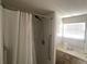 Bathroom featuring shower stall, sink, vanity and a window at 1710 7Th Sw St # 82, Ruskin, FL 33570