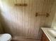 Bathroom featuring a half-bath with sink, vanity, toilet, and laminate flooring at 1710 7Th Sw St # 82, Ruskin, FL 33570