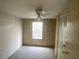 Bedroom featuring paneled walls, a ceiling fan, a window and a closet at 1710 7Th Sw St # 82, Ruskin, FL 33570