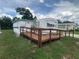 Attractive mobile home featuring a convenient access ramp and a fresh, clean exterior at 1710 7Th Sw St # 82, Ruskin, FL 33570