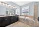 Elegant bathroom featuring a double vanity, soaking tub, and shower at 17651 Bright Wheat Dr, Lithia, FL 33547