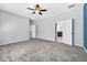 Spacious bedroom with carpet and access to a bathroom at 17651 Bright Wheat Dr, Lithia, FL 33547