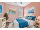Stylish bedroom with artistic decor, a comfortable bed, and a sunny window view at 17651 Bright Wheat Dr, Lithia, FL 33547
