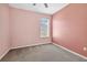 Comfortable bedroom with a view from the window and neutral colored carpeting at 17651 Bright Wheat Dr, Lithia, FL 33547