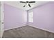 Bedroom featuring neutral carpet and a ceiling fan at 17651 Bright Wheat Dr, Lithia, FL 33547