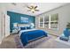 Comfortable bedroom featuring a large window and a bed at 17651 Bright Wheat Dr, Lithia, FL 33547