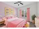 Bedroom with colorful decor and a large window at 17651 Bright Wheat Dr, Lithia, FL 33547