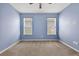Bedroom with neutral carpet, a ceiling fan, and natural light at 17651 Bright Wheat Dr, Lithia, FL 33547