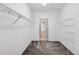 Walk-in closet with wire shelving and neutral carpet at 17651 Bright Wheat Dr, Lithia, FL 33547