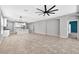 Spacious open-concept living room with tile floors and kitchen views at 17651 Bright Wheat Dr, Lithia, FL 33547